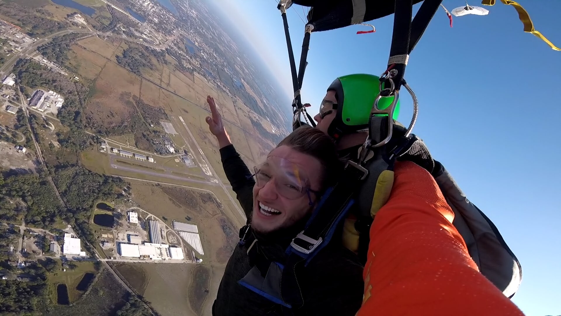 Shayne McKee skydiving with hands up